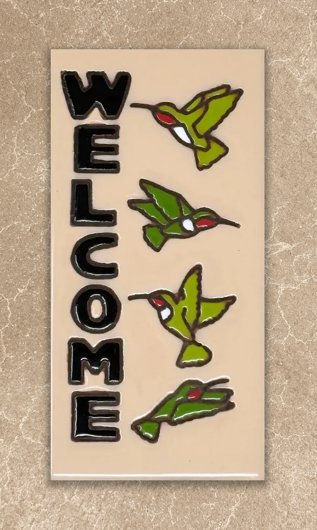 welcome hummingbirds tile on beige background