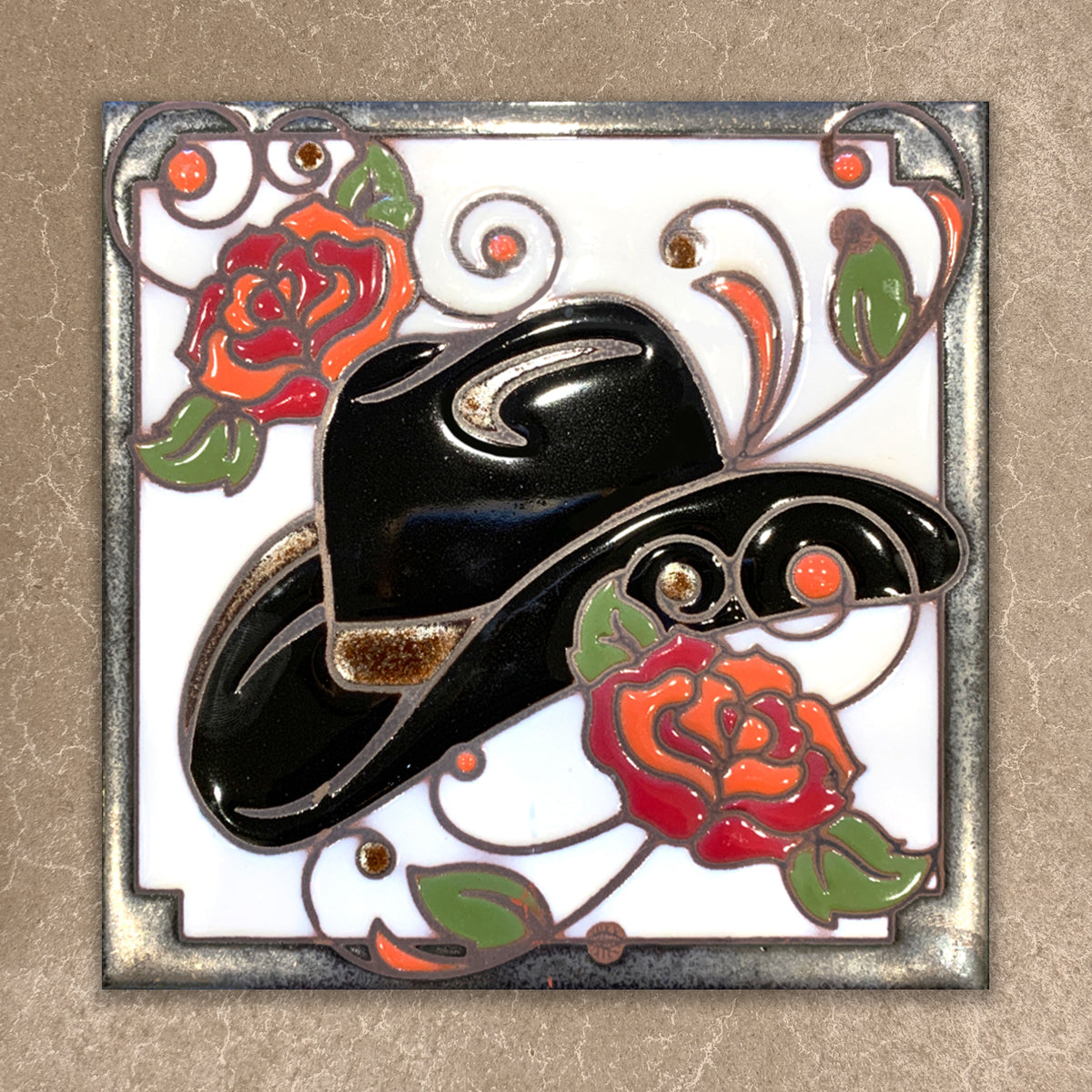 Pin with black cowboy hat and red roses on a decorative background
