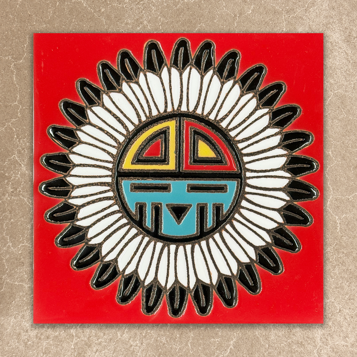 Decorative tile with a tawa design on a red background
