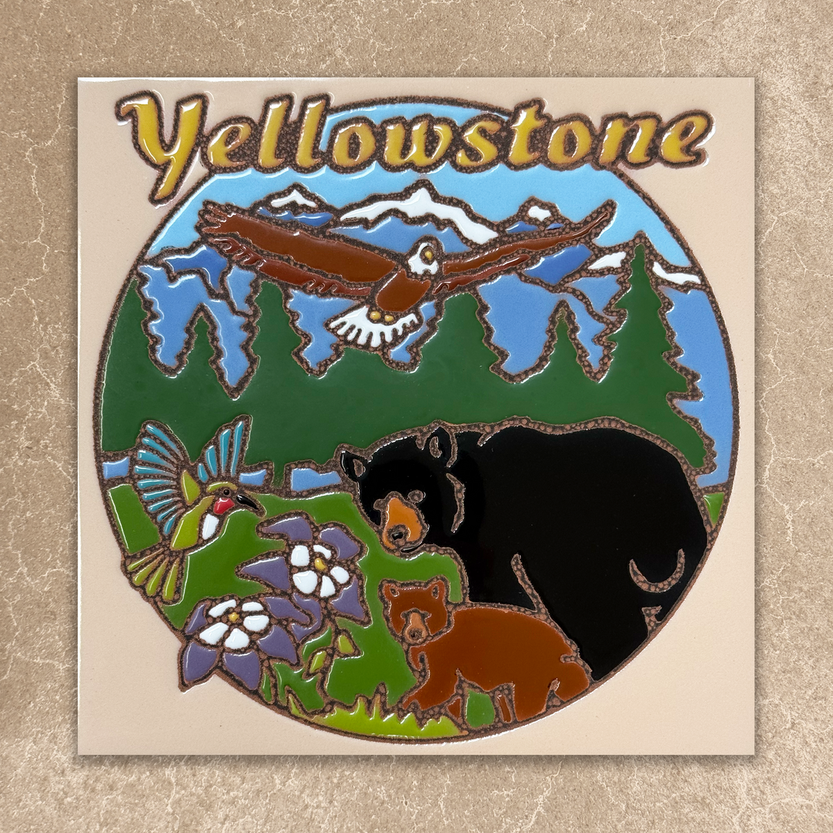 Yellowstone-themed tile with bears, birds, and flowers on a beige background