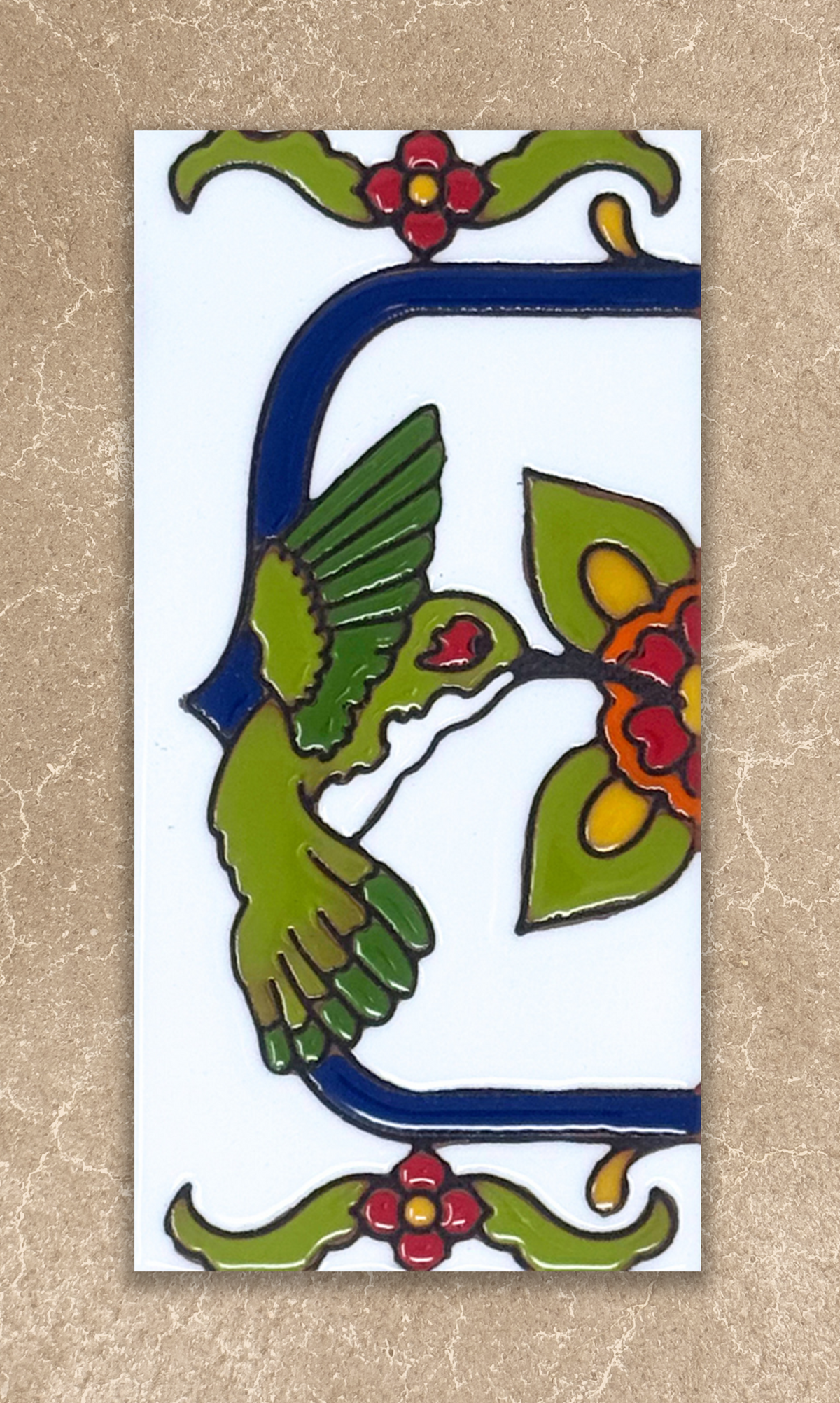 Decorative tile with a green bird, red flowers, and blue border on a beige background