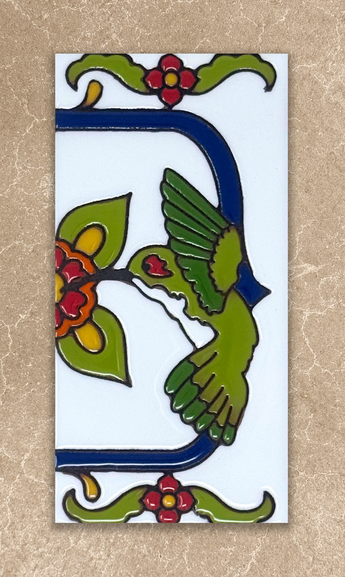 Decorative tile with a green bird and red flowers on a beige background