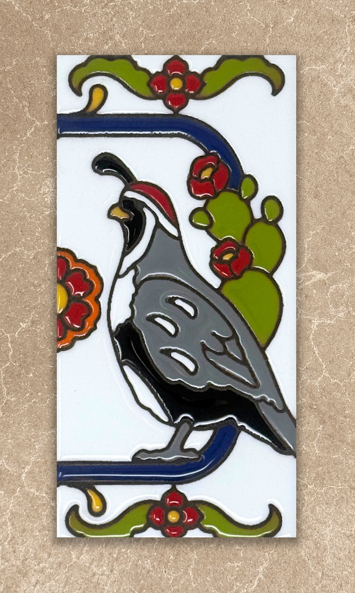 Decorative tile with a quail and cactus design on a beige background