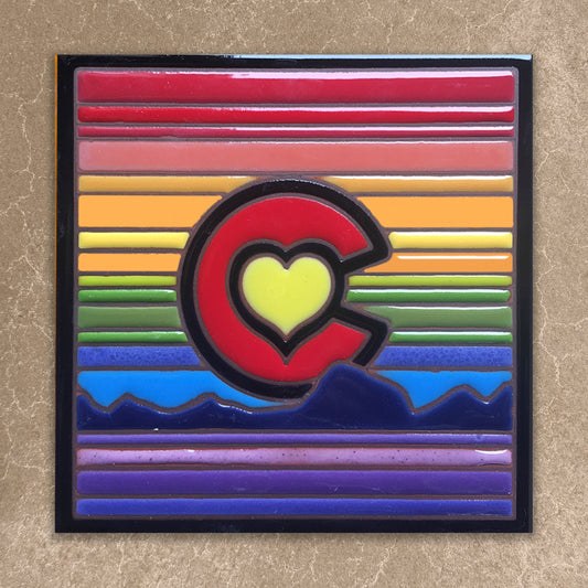 Colorful tile with a heart-shaped 'C' on a striped background