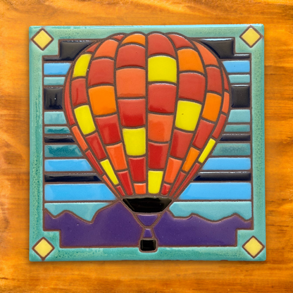  vibrant 6”x6” Patchwork Hot Air Balloon ceramic tile design, inspired by the iconic Albuquerque International Balloon Fiesta and the colorful skies of New Mexico. 