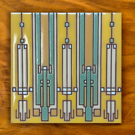 Yellow and Green geometric ceramic tile on a wooden background