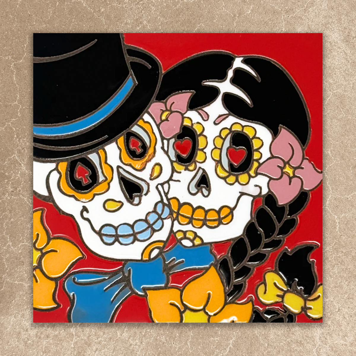 Colorful illustration of two sugar skull characters with flowers on a red background