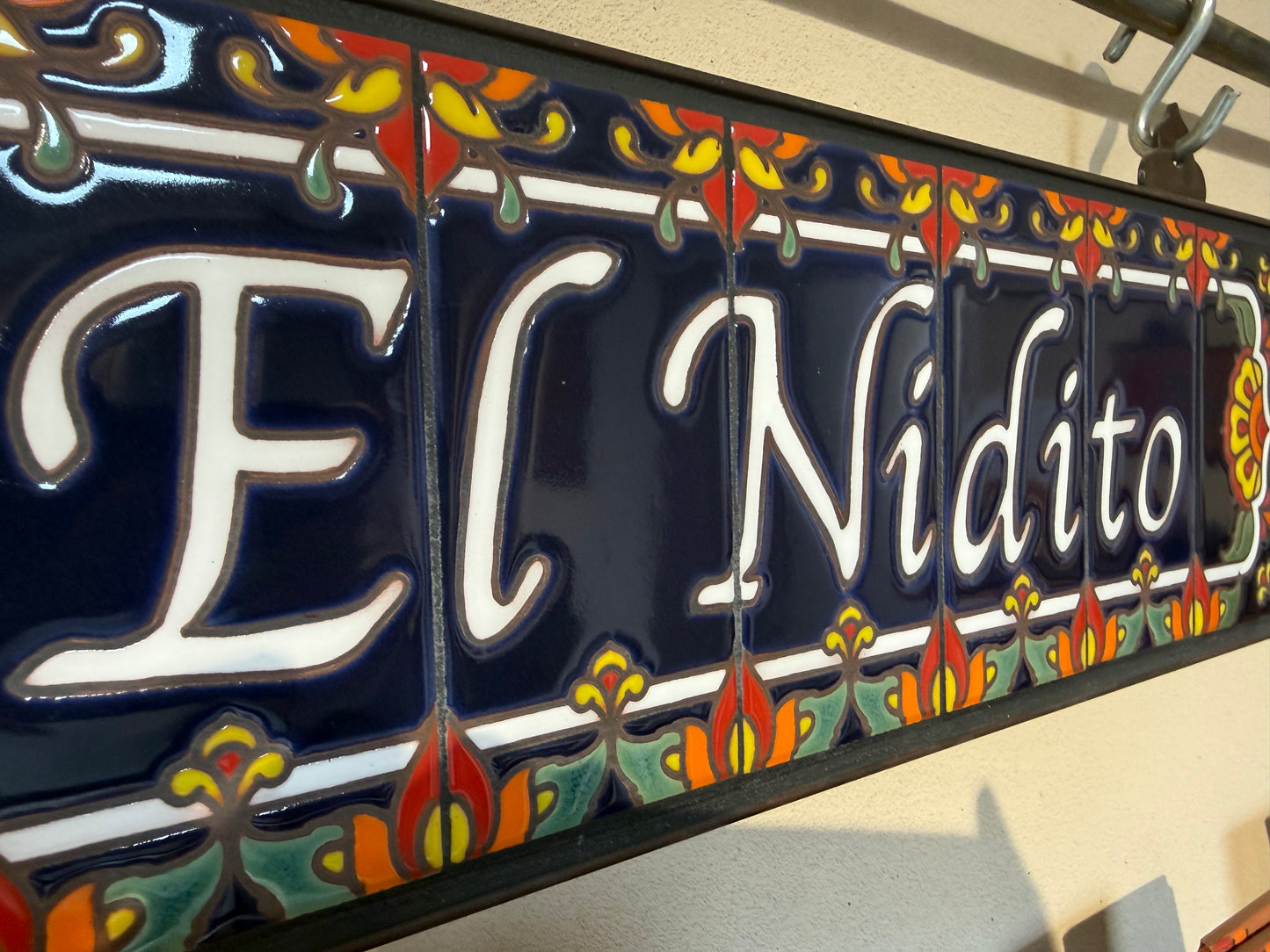 Custom House Sign with Talavera End Caps, Dark Blue Background, and White Letters