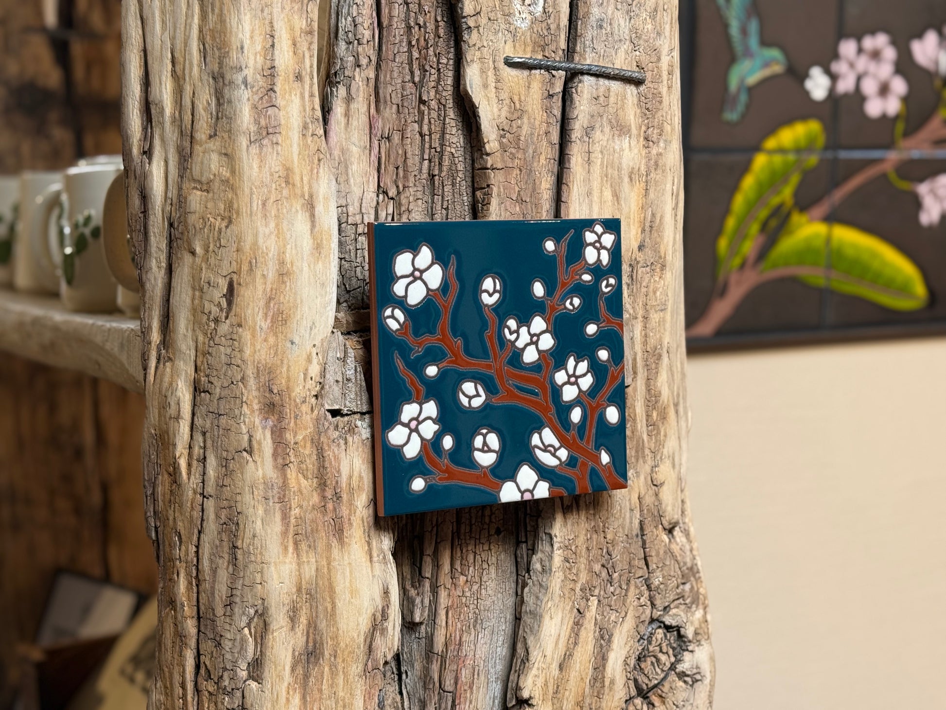 Decorative wall art with floral design on a wooden surface