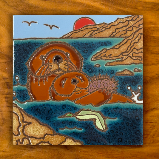 Sea Otter Ceramic tile on a wooden background