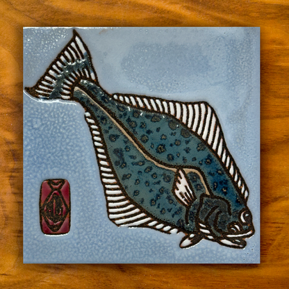 halibut ceramic tile on a wooden background