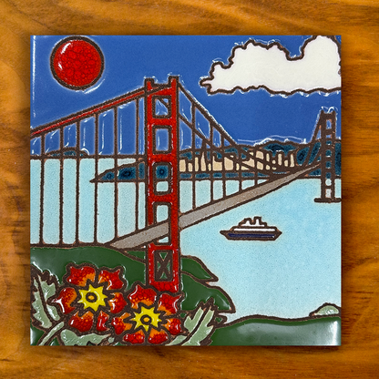 golden gate bridge hand painted ceramic tile on a wooden background