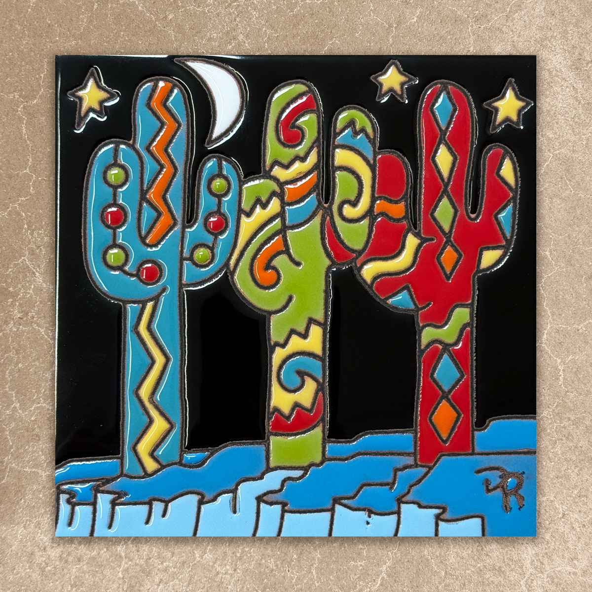 Colorful abstract depiction of cacti with a moon and stars on a beige background