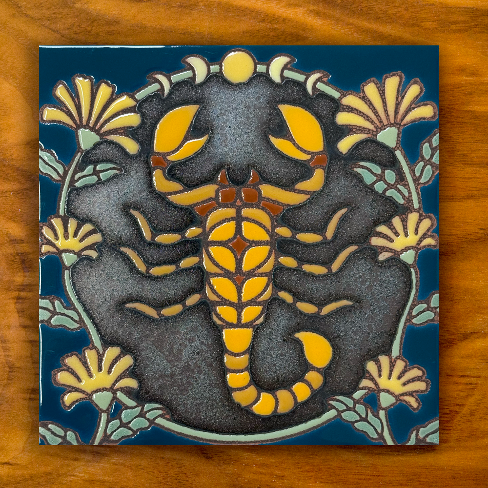 Scorpion with yellow flowers ceramic tile on a wooden background