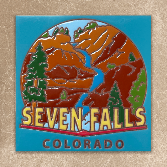 tile  with 'Seven Falls Colorado' design on a textured beige background