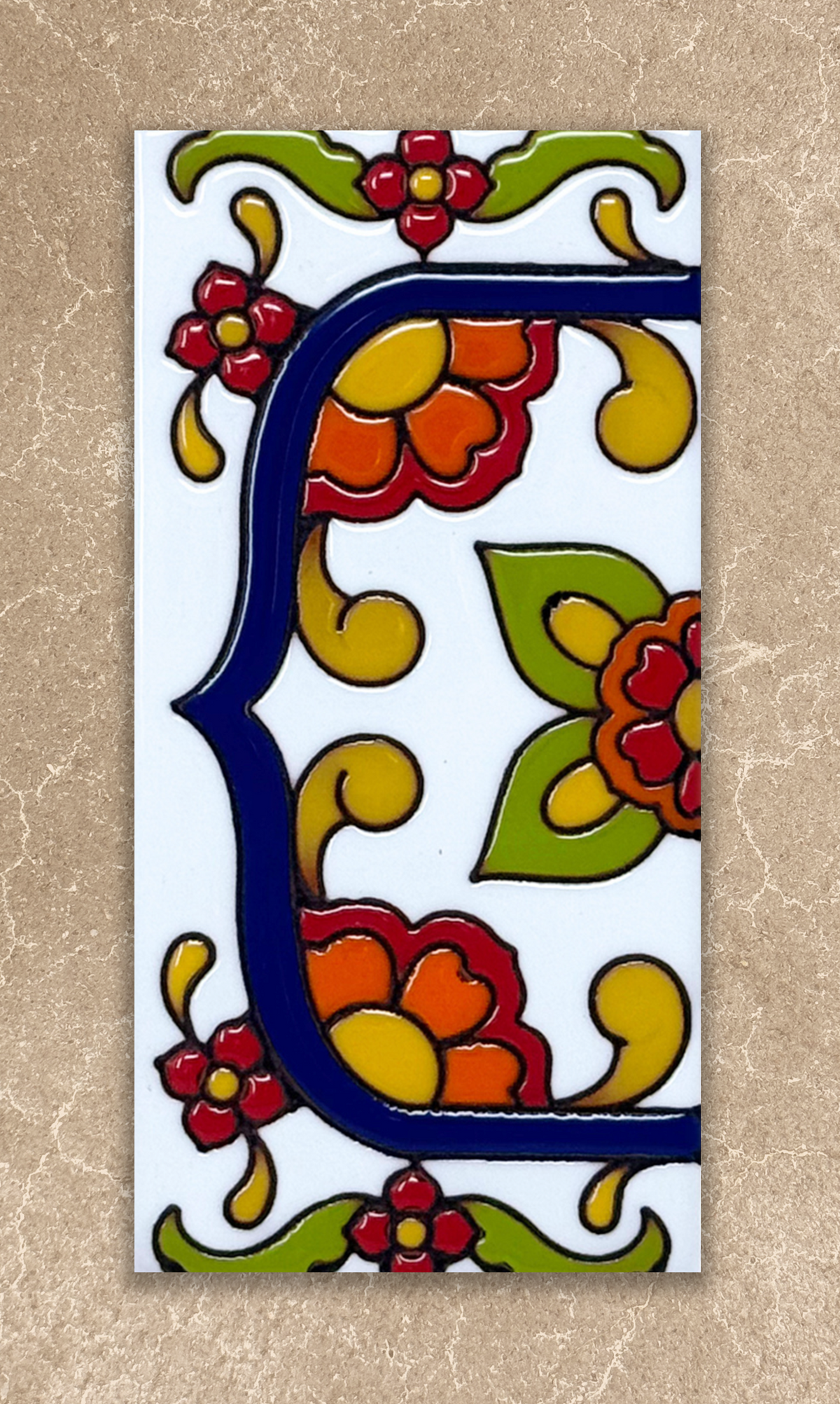 talavera house number end cap tile on beige background