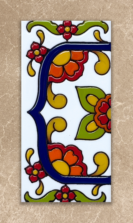talavera house number end cap tile on beige background