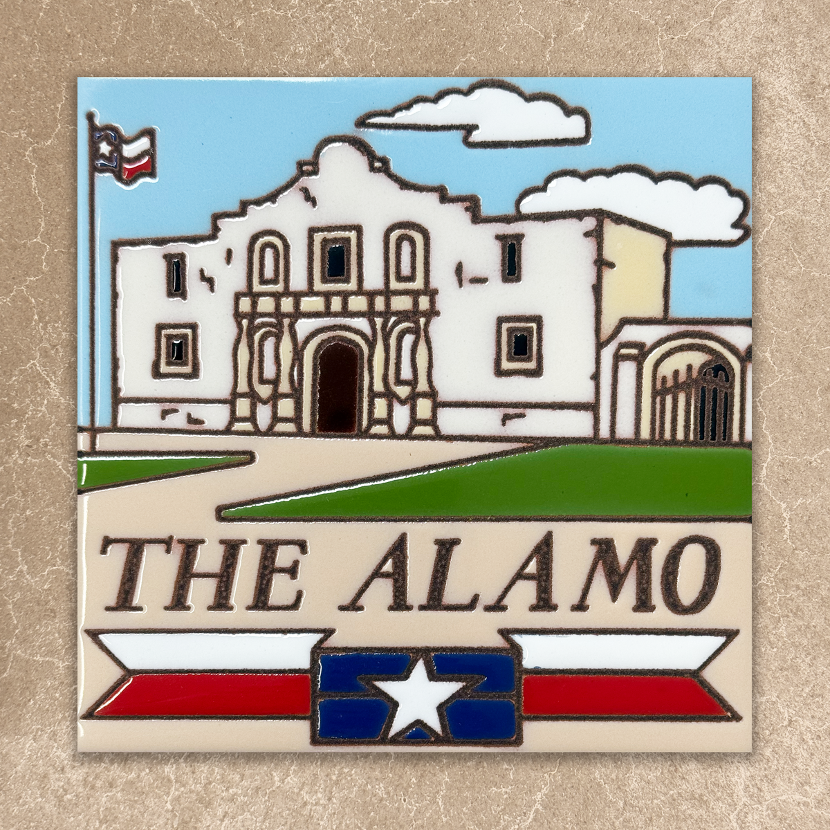 Decorative sign of The Alamo with Texas flag on a beige background