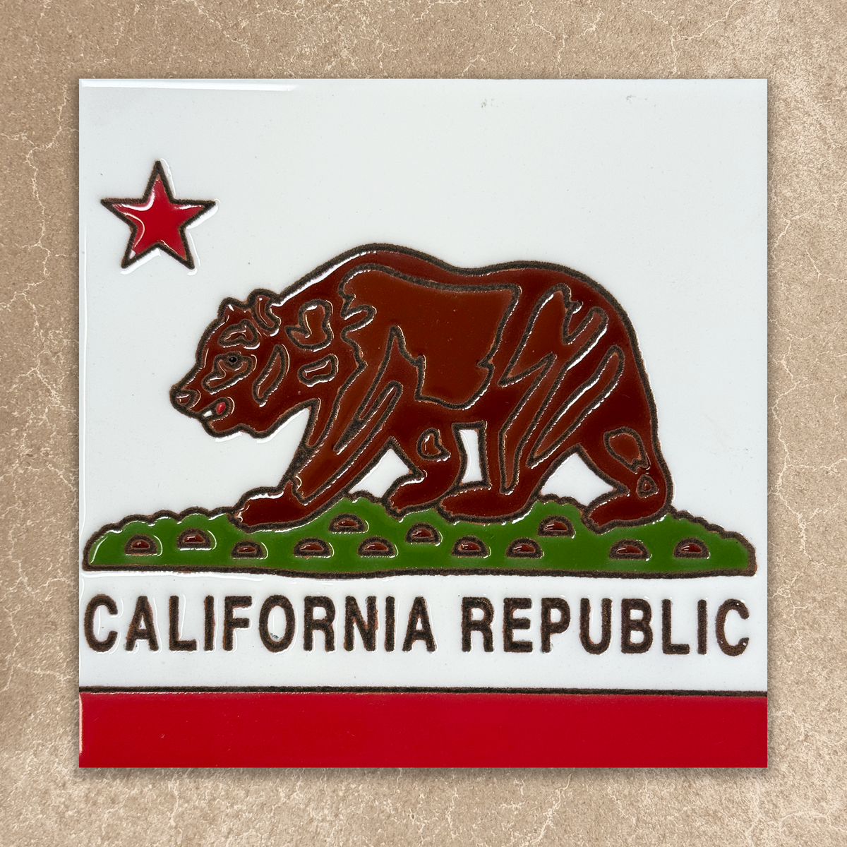 California Republic emblem with bear and star on a white background