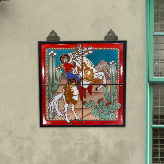 Decorative tile with a cowgirl and horse design on a wall.
