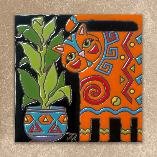 Colorful ceramic tile with a cat and plant design on a beige background