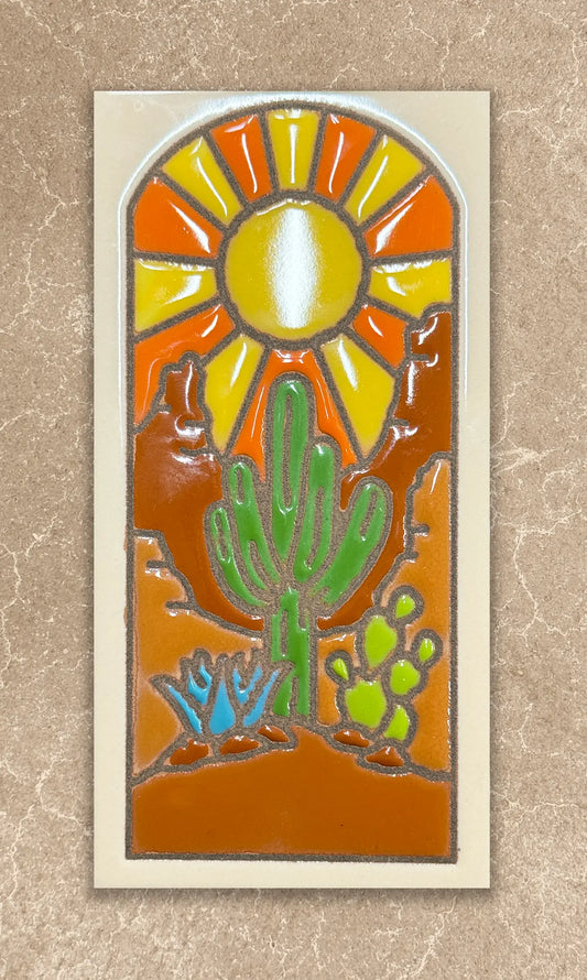 Decorative tile with a cactus and sun design on a beige background