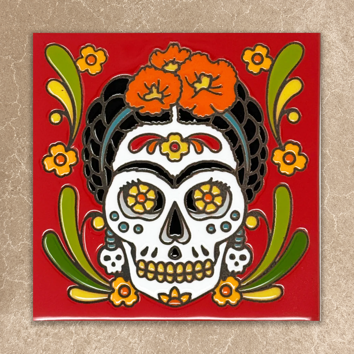 Decorative tile with a colorful skull design on a red background