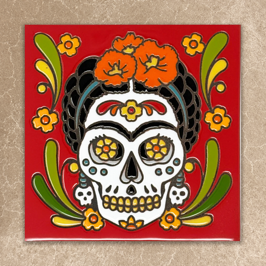 Decorative tile with a colorful skull design on a red background