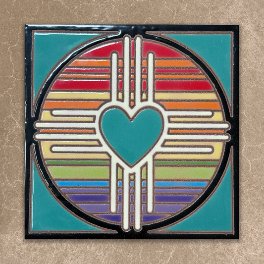 Decorative tile with a heart design and rainbow colors on a beige background