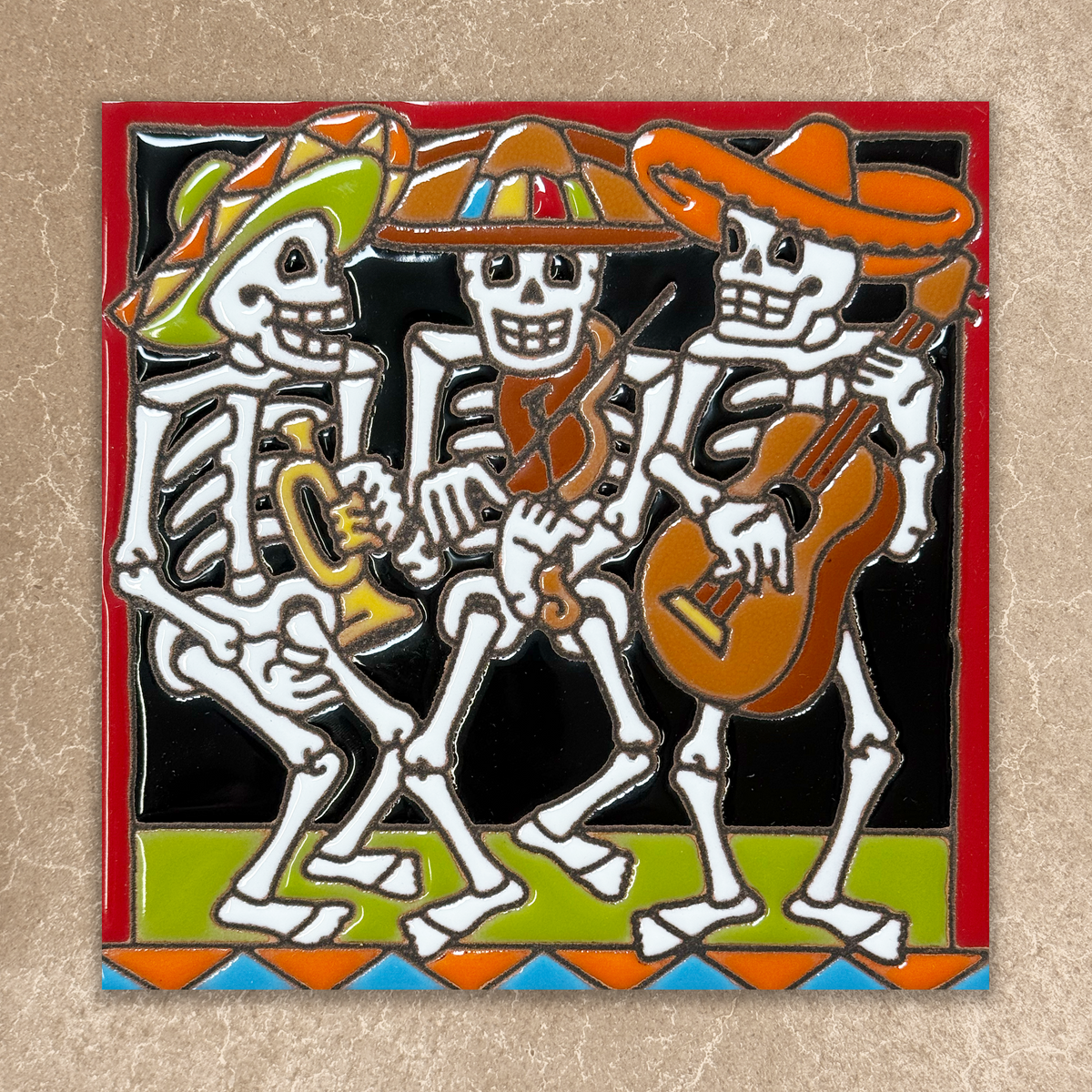 ceramic tile with skeletons playing music on a beige background