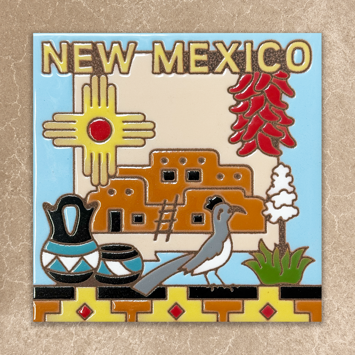 Decorative emblem featuring New Mexico elements such as a sun, traditional building, and desert scene on a beige background.