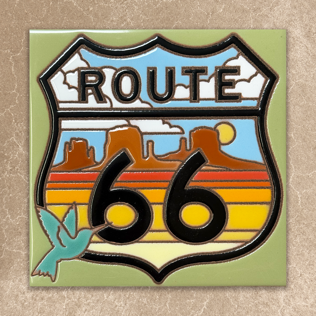 Route 66 emblem with desert landscape and blue sky on a beige background
