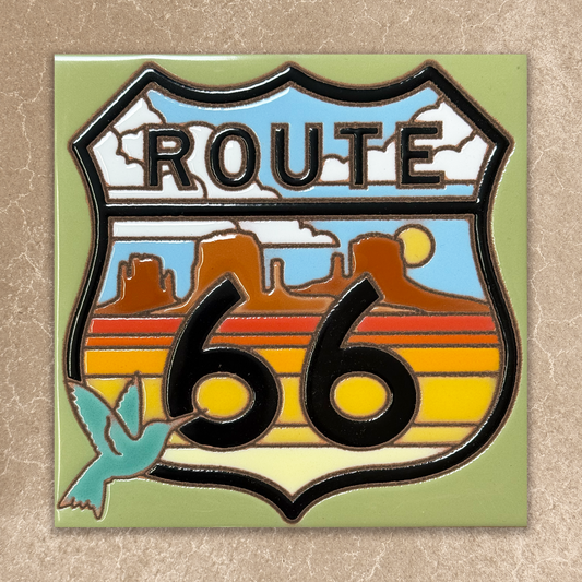 Route 66 emblem with desert landscape and blue sky on a beige background