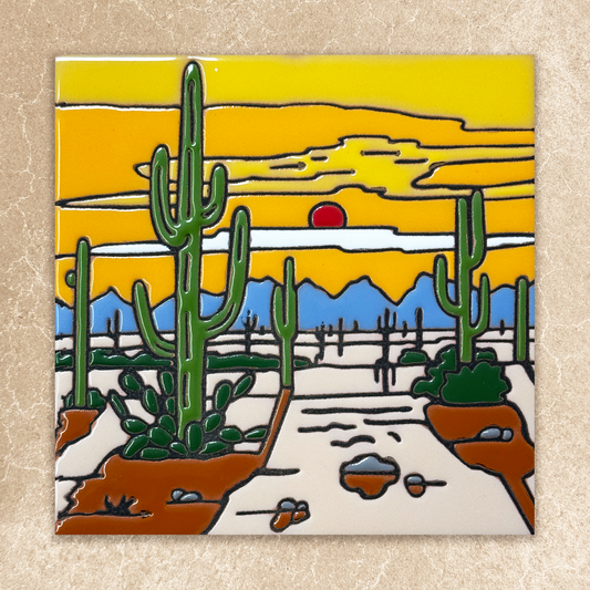 Desert scene with cacti and a sunset on a ceramic tile