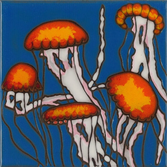 A square glass tile featuring a stylized illustration of jellyfish in orange and yellow against a vibrant blue background, with white and pink tentacles outlined in dark brown.