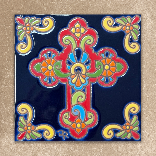 Decorative tile with a colorful cross design on a blue background