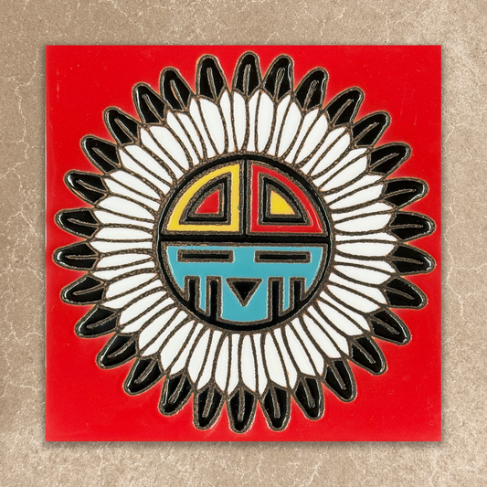 Decorative tile with a tawa design on a red background
