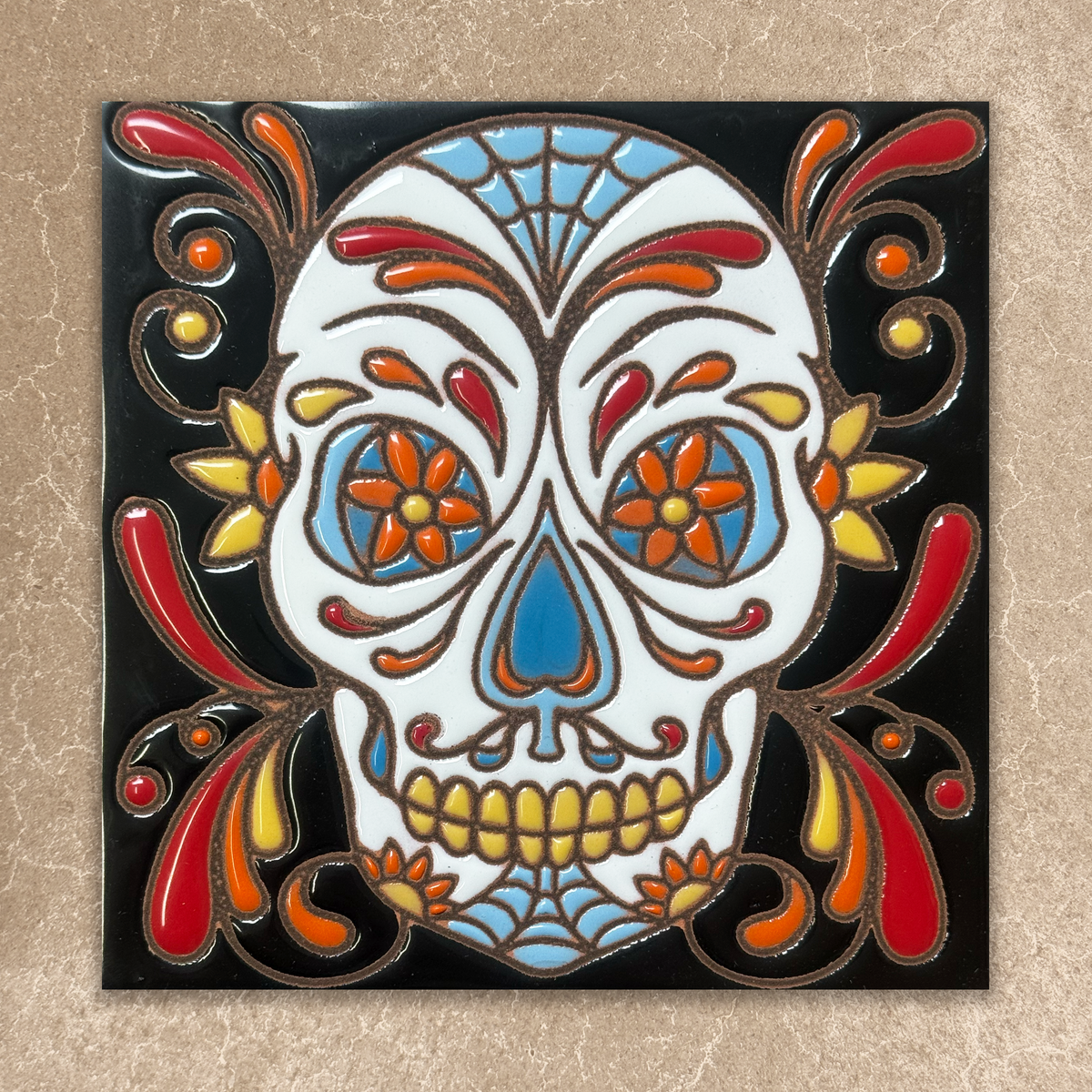 Colorful skull design with floral elements on a beige background
