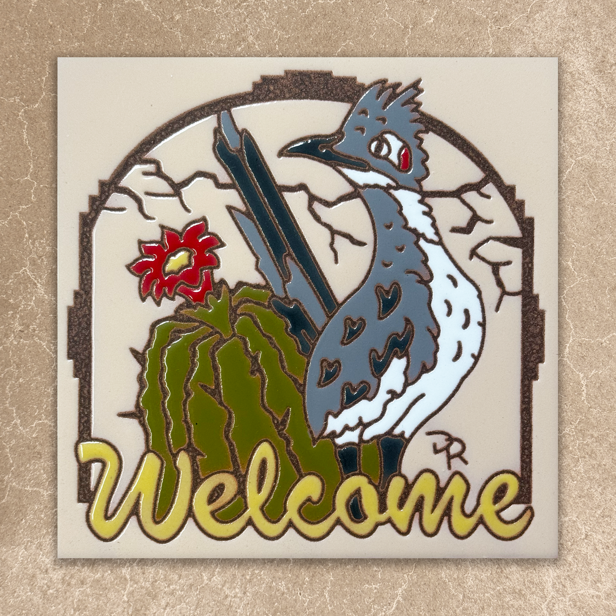 Decorative sign with a bird, cactus, and 'Welcome' text on a beige background