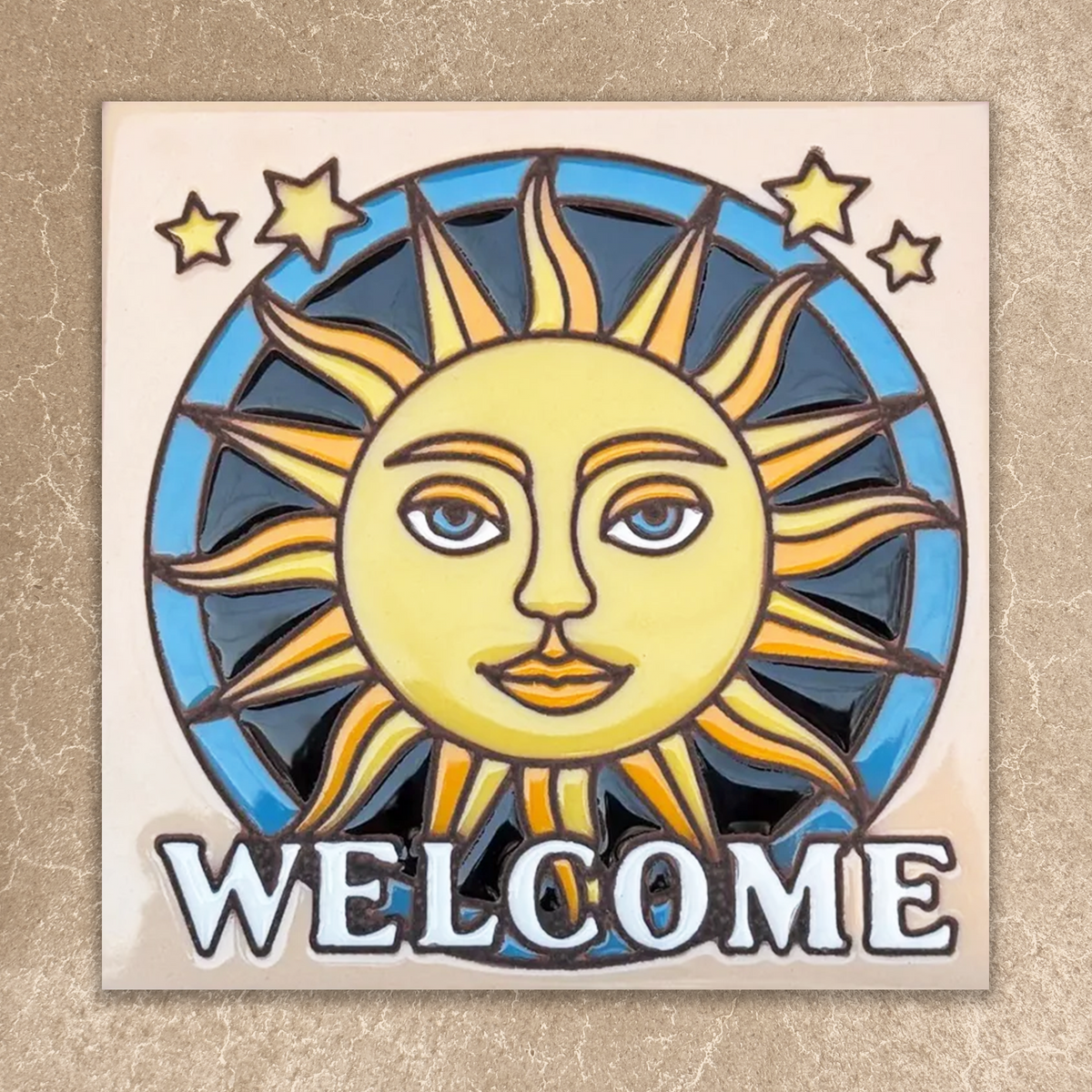 Decorative welcome sign with sun and stars design on a beige background